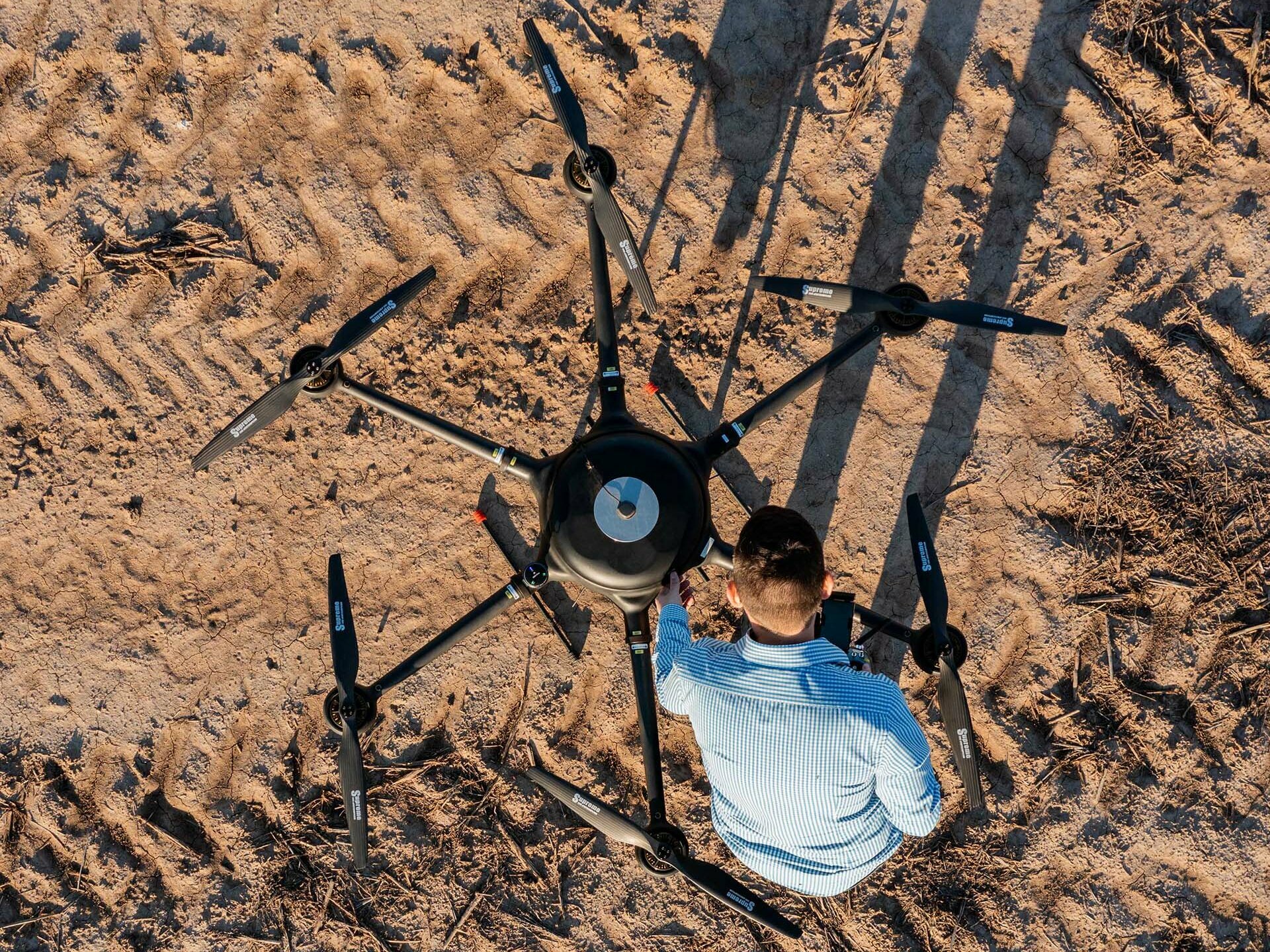 aerial view of a man and a large drone