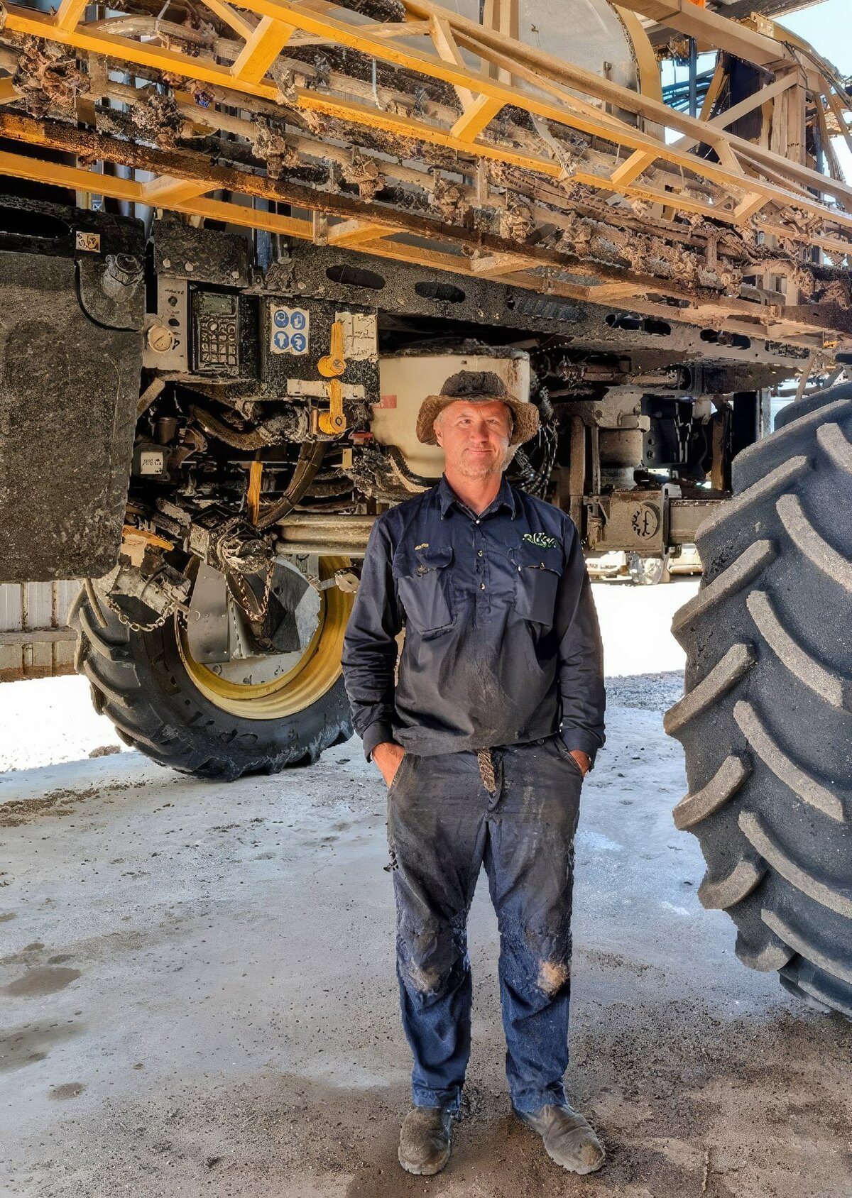 Wade Bidstrup of Warra stands in front of a large sprayer